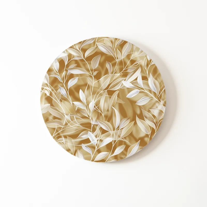 Natuurlijke gouden bladeren op een dibond muurcirkel.