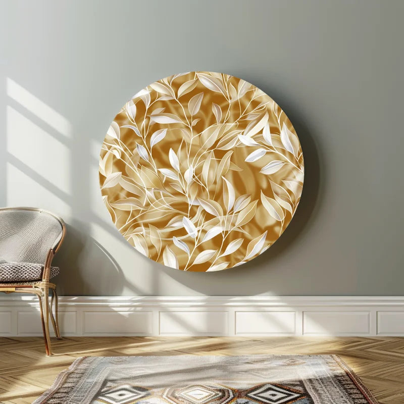 Dibond muurcirkel met een elegant bladpatroon in goud.